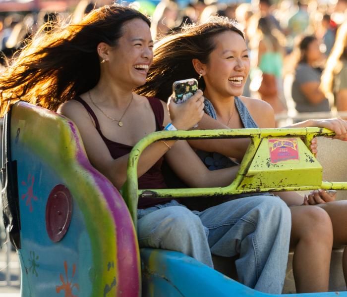 Two students on a ride at a carnival